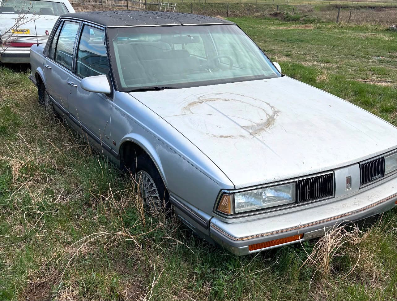 Abandoned sedan ready for junk car removal in Red Deer