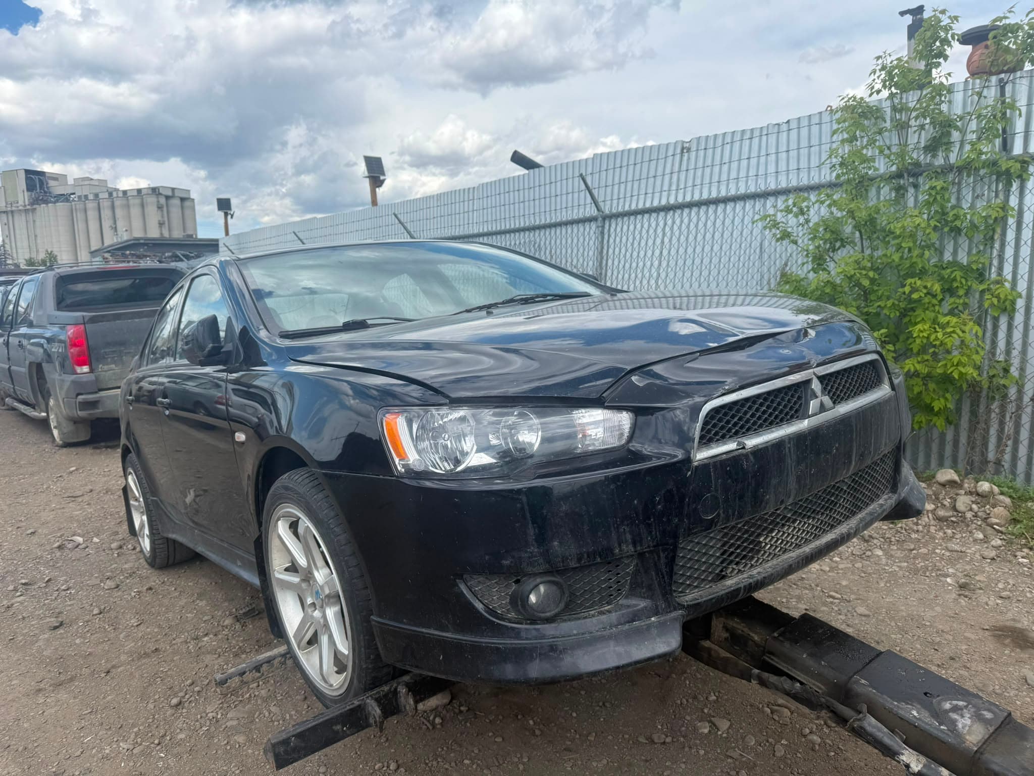 End-of-life sedan at a vehicle recycling yard