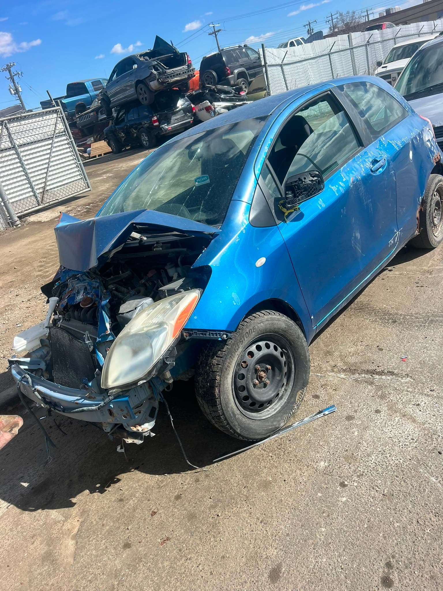 Collision damaged vehicle waiting for removal in Red Deer